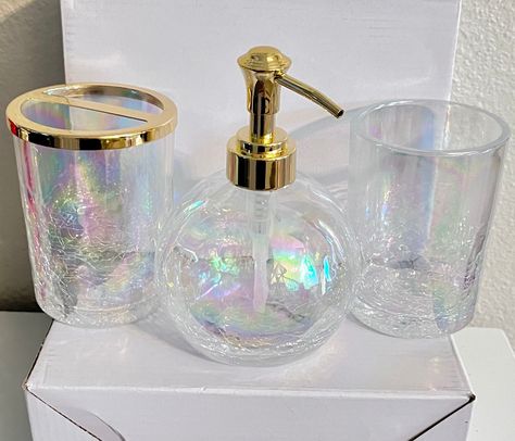 limited edition Hand sprayed  iridescent vintage  color these bathroom accessories are simply gorgeous!  Each one is a cracked glass style that has been hand sprayed with i iridescent color then a clear gloss over then cured for 30 Days!!   will offer as set or singles  I do not plan on restocking once these sell out as the base materials are no longer available will be adding new updated styles soon!  Etsy seems to think the soap dispenser  is illegal in its true colors... not sure why but I ed Iridescent Soap Dispenser, Bubble Bathroom Decor, Pearl Bathroom Decor, Iridescent Bathroom Decor, Bubble Bathroom Theme, Holographic Bathroom, Irridescent Bathroom, Gold Trim Bathroom, Opal Bathroom