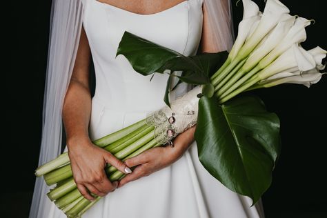 Long stem calla lily bridal bouquet with large tropical leaf accents. Calla Lily Bridal Bouquet, Lily Bridal Bouquet, Ritz Carlton Wedding, Calla Lily Bridal, Tropical Leaf, Ritz Carlton, Calla Lily, Bridal Bouquet, Lily