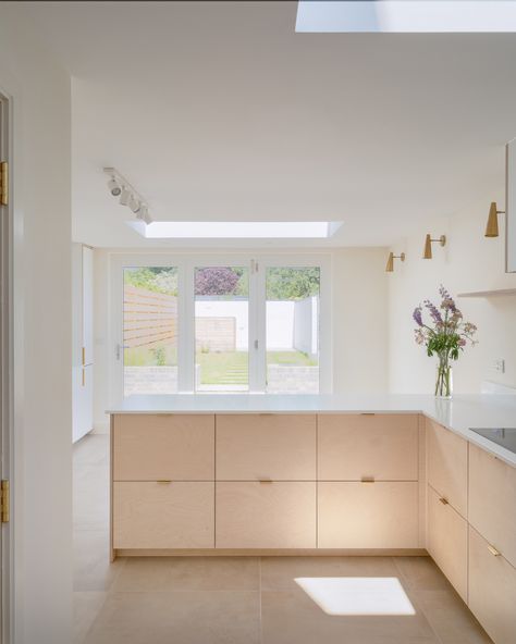 Plykea Fenix Bianco Kos kitchen fronts are combined with birch plywood and brass edge pull handles to create this tranquil light-filled Cambridge kitchen. All using IKEA Metod or Sektion cabinets. #plywoodkitchen #birchplywood #plywood #ikeahack #kitchenideas #kitchentrends 📷 Richard Fraser Photography Baltic Birch Plywood Cabinets, Ikea Metod Kitchen Island, 2m Kitchen, Birch Kitchen, Frojered Kitchen, Birch Ply Kitchen, Ply Kitchen, Ikea Sektion Kitchen, Birch Plywood Kitchen