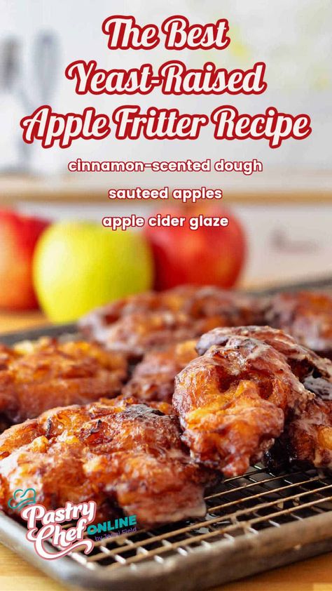 Pin image for apple fritters. Text reads, "The best yeast-raised apple fritters: cinnamon-scented dough, sauteed apples, apple cider glaze." Image shows fritters cooling on a cooling rack with 2 red and 1 green apple in the background. Deep Fried Apple Fritters, Yeast Apple Fritters, Apple Fritters Air Fryer, Red Apple Recipes, Apple Fritters Cake Recipe, Sweet Fritters, Apple Fritter Recipe, Sauteed Apples, Apple Fritters Recipe