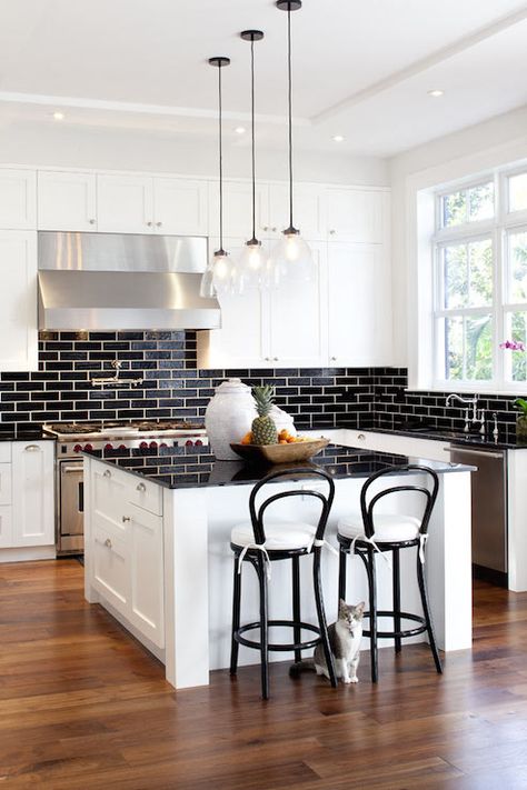 black and white kitchen, shaker cabinets, shaker kitchen cabinets, black subway tiles Industrial Kitchens, Backsplash Kitchen White Cabinets, Backsplash For White Cabinets, Black Countertop, Trendy Kitchen Tile, White Shaker Kitchen Cabinets, Kitchen Facelift, Trendy Kitchen Backsplash, Kitchen Colours