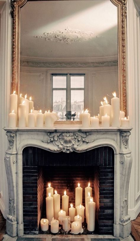 Pillar Candles In Fireplace, Electric Candles In Fireplace, Staged Fireplace, Vintage Fireplace Mantle Decor, Goth Fireplace, Fireplace With Candles Inside, Fireplace Candles Inside, Paris Fireplace, Candles In Fireplace Ideas