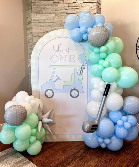 This "Hole in One" Arch is the perfect statement piece for your little golfer's first birthday par-tee! NOTE: You are ONLY purchasing the DIGITAL design, not a physical arch. It is up the buyer to send this design to a local print shop & pick it up/set it up on their own. It is recommended that the design is printed on either foam board or vinyl, then attached to a wooden or foam arch board. It is also recommended that the buyer has the design printed at the size 4'X7' because those are the dimensions of the arch. Lastly, it is encouraged to set up the printed design alongside a stunning balloon arch that matches the color scheme of the design because that makes it look extra cute! Please feel free to tag me on Instagram @little.red.designs1 because I would LOVE to see the ways in which yo Hole In One Backdrop, Golf Balloon Arch, 1st Bday Themes For Boys, Hole In One First Birthday, Arch Board, Baby Birthday Party Theme, First Birthday Balloons, Par Tee, Golf Birthday Party