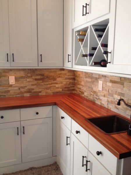 Butcher block and stone backsplash Backsplash With Butcher Block Counters, Hardwood Countertops, Butcher Block Counters, Wood Countertop, Butcher Block Counter, Countertop Material, Countertop Surfaces, Stone Backsplash, Wooden Counter