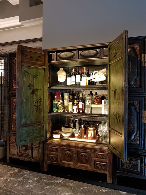 The coolest bar cabinet! Antique lacquered cabinets from Teochew, China. Photo credit: Calvin of eco-id Architects (Singapore). #ChineseAntiqueFurniture #ChineseAntique #InteriorDesign #ChineseInteriors #BlackAndGold #InspiringInteriors #LitAF Lacquered Cabinets, China Photo, Bar Cabinets, Antique Chinese Furniture, Chinese Interior, Chinese Furniture, Bar Cabinet, Cool Bars, Chinese Antiques