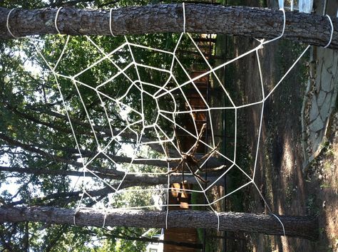 Giant spider web! All it takes is rope and zip-ties. So fun and easy! Happy Halloween! Rope Spider Web Diy, Rope Spider Web, Diy Giant Outdoor Spider Web, Garbage Bag Spider Web, Pvc Spider, Diy Huge Spider, Spider Web Diy, Giant Spider Web, Halloween Tricks