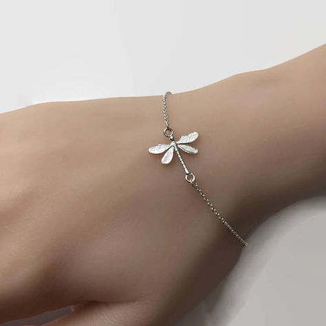 A delicate sterling silver bracelet with a detailed sterling silver dragonfly link, connected to sterling silver chain. Adjustable bracelet length from approx 6.5 to 7.5. Simple and it looks good with anything! Please read our store polices before placing an order: Cute Silver Bracelets, Dragonfly Bracelet, Dragonfly Jewelry, Jewelry Design Earrings, 5 To 7, Classy Jewelry, Matching Jewelry, Funky Jewelry, Fantasy Jewelry