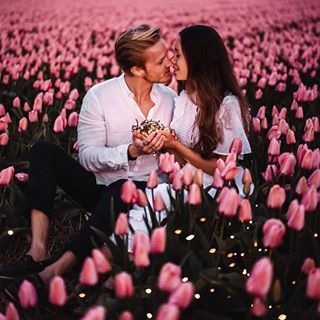 Travel Couples Adventure (@earthcouples) • Instagram photos and videos Photoshoot Wallpaper, Zicxa Photos, Farm Engagement Photos, Field Engagement Photos, Amsterdam Photos, Field Photoshoot, Tulip Field, Spring Photoshoot, Flower Photoshoot