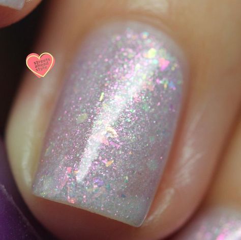 Aurora nails are — as their name may suggest — pretty magical. If you’ve been eyeing up nail trends to inspire your next mani, you’ve likely come across this enticing term. But what exactly are aurora nails? Here’s what you need to know, including where the design comes from, and how to do aurora nails at home — because as fantastical as they are, they are not beyond the scope of a good DIY project. Thermal Nail Polish, Nail Business, Shimmer Nail Polish, Aurora Nails, Pink Nail Polish, In Disguise, Pink Nail, Instagram S, Nails At Home