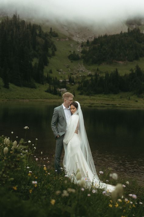 Hannah and Marcus decided to elope in the stunning mountains of Mount Rainier. Their intimate adventure elopement was sweet, surrounded by close family and friends. I feel fortunate to capture these romantic moments. If you need a wedding photographer for your destination elopement, reach out through my website today! Mountain Wedding Bride And Groom, Elopement Wedding Mountain, Bride And Groom Mountain Photos, Elopement Aesthetic Mountains, Ireland Wedding Elopement, Montana Wedding Elopement, Dreamy Elopement Photos, Nature Elopement Photos, Bridal Photos Mountains