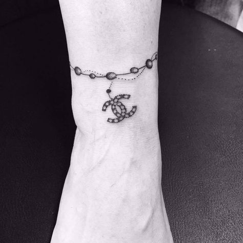 Chanel Tattoo | Tattoo Ideas and Inspiration Coco Chanel Tattoo Ideas, Chanel Tattoo Ideas, Dior Tattoo, Chanel Tattoo, Chain Tattoo, Sweet Tattoos, Chanel Chain, Tattoo Girls, Arm Tattoos