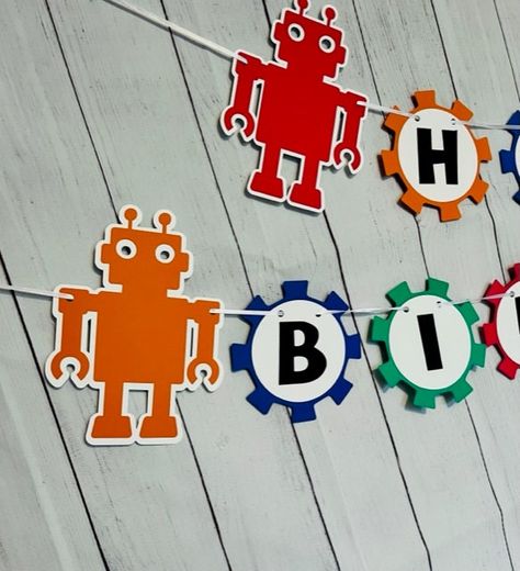 Rebecca Ann Designs Robot Birthday Banner is Amazing! This Robot Themed Birthday Banner is perfect for your little ones birthday Party Decor. Banner is colorful with Robots at the ends Name and or Age can be added at checkout. Click here for more Robot Party Decor: https://etsy.me/3W9bqm0 Robot Party Decorations, Robot Party Ideas, Robot Themed Birthday Party, Robots Party Theme, Robot Birthday Party Decorations, Robot Birthday Party, Robot Theme, Cricut Birthday, Robot Party