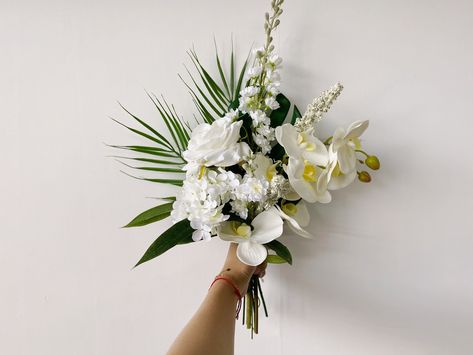 "Size about 25cm/10\" wide and 30cm/12\" tall Material silk flowers, faux foliage, etc.  Flowers & Foliages rose, delphinium, butterfly orchid/phalaenopsis, monstera, palm leaf, etc. Colors white and green, etc. * Please kindly note that my shop is based in China, so all the flower works in my shop will be shipped abroad. *" Wedding Small Bouquets, Bridesmaid Bouquet Tropical, Palm Leaf Bouquet, Wedding Flower Arrangements Fall, White Delphinium, White Orchids Wedding, Tropical Bridal Bouquet, Leaf Bouquet, Tropical Wedding Bouquets