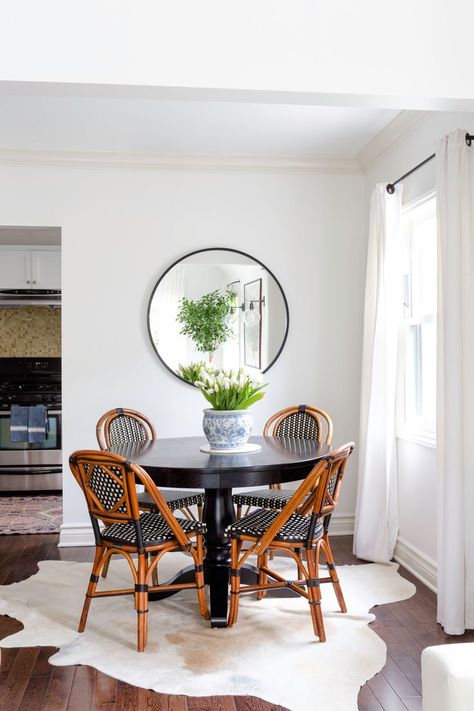 A petite dining situation is the perfect solution for this cozy two-bedroom. Here, classic French bistro chairs from Maison Midi surround a black Avalon round dining table from Crate & Barrel. Black Round Table, Black Round Dining Table, French Bistro Chairs, Round Chair, Bistro Chairs, California Cool, Modern Round, Round Table, Room Table