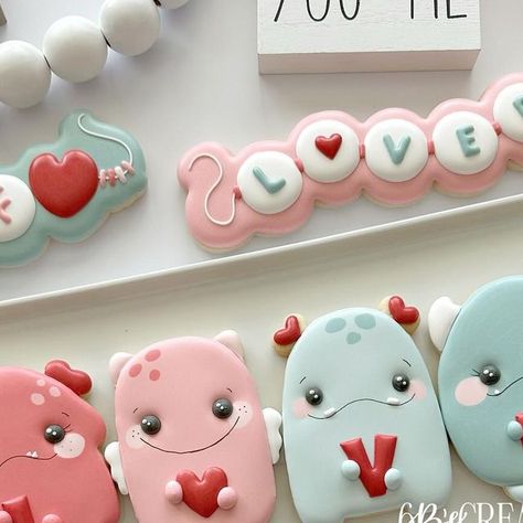 Brittany Geil on Instagram: "Valentine’s Day cookies are just not complete without an adorable set of Love Monsters 😍 I hope you’re all surviving your Valentine’s Day cookie orders! The end is in sight 🙌🏻 Let me know below if you’re all done with orders or if you have a few more to get out the door 💕 . . . . . #valentinesdaycookies #lovemonsters #lovemonsterscookies #cookies #sugarcookies #decoratedcookies #royalicingcookies #customcookies #cookiesofinstagram #sharethecookie #6bscreations #6bsinsiders  #eastvalecookies #jurupavalleycookies #riversidecookies #inlandempirecookies" Sugar Cookie Valentines Day Royal Icing, Valentine Heart Cookies Royal Icing, Valentines Monster Cookies, Heart Royal Icing Cookies Valentines Day, Valentine Cookie Sets Royal Icing, Love Monsters, Love Monster, Valentines Day Cookies, Custom Cookies