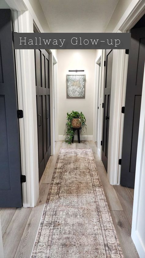 Hallway Glow-up, Mission Accomplished ✨️ It's now been six months since I painted the first door in our hallway. I admit, I was a bit nervous to go with this color. Worried that the dark would show dust and fingerprints. Also, what if the paint scratches or chips and I'm constantly touching up paint! Well, there are minimal issues with dust or fingerprints. I just use my favorite velvet cloth and wipe them down (everyone needs to have these in their home). Also, there are no chips or scratch Hallway With Painted Doors, Hallway Doors Ideas, Dark Entryway Paint Colors, Wainscoting Hallway Ideas, End Of Hallway Wall, Painted Hallway Doors, Windfresh White, Moody Hallway, Accent Hallway