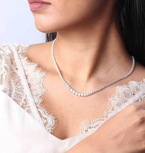 Say hello to your new go-to piece: the round diamond tennis necklace!This stunning beauty goes with everything—whether you’re rocking a casual outfit or getting glammed up for a night out. Who knew diamonds could be so versatile and fun? Get ready to sparkle in style!✨ 📍Altamount Road, Mumbai To book an appointment contact us at +91 93721 03005 For price related queries, reach out to us via WhatsApp on +91 9372103005 or email us at sarika@sarikafinejewellery.in #SarikaGarg #sarikafinejew... Luxury Silver Tennis Necklace For Evening, Luxury Rose Gold Diamond Tennis Necklace, Luxury Silver Diamond Station Necklace, Kisna Diamond Jewellery, Cubic Zirconia Tennis Necklace With Prong Setting, Everyday Luxury, Diamond Tennis Necklace, Tennis Necklace, Round Diamonds, Night Out