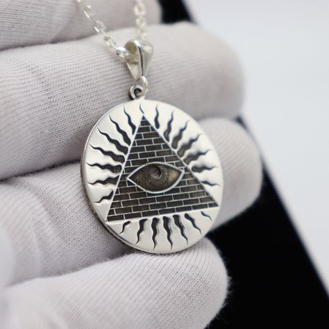 ★Item Details * Gender: Male / Female * Material:  925 Sterling Silver * Finish: Polished  * Chain : 925 Sterling Silver * Shipping: 2-5 days  * Handmade * Personalization: YES This unique and captivating necklace dazzles with its profound symbolism. A rising pyramid within a circular frame is crowned by the Masonic central symbol, the All-Seeing Eye. Surrounding the pyramid are shapes symbolizing rays of sunlight, representing the power of illumination and wisdom-filled life. Carefully crafted Masonic Symbols, Circular Frame, Symbol Necklace, All Seeing Eye, Pyramid, Jewelry Gift, Favorite Jewelry, Jewelry Necklace Pendant, Etsy Accessories