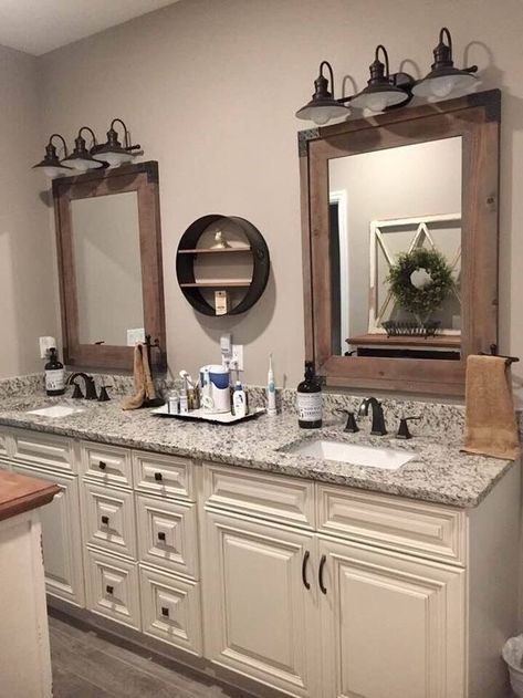 Beautiful bathroom with double sink, granite countertops, cream cabinets, and iron light fixtures Bathroom Mirror Inspiration, Makeover Kamar Mandi, Muebles Shabby Chic, Bathroom Cabinets Diy, Master Bath Remodel, Zoella, Rustic Bathrooms, Lodge Decor, Bathroom Renos