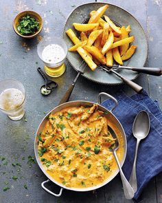 Dunking an Indian-spiced chip into creamy chicken masala curry is surely comfort food at it's finest. Lisa Markwell's recipe is one to enjoy with friends and a cold beer or two. Chicken And Chips, Masala Sauce, Poultry Dishes, Chicken Chunks, Indian Chicken, Chicken Masala, Delicious Magazine, Curry Chicken Recipes, Chicken Curry