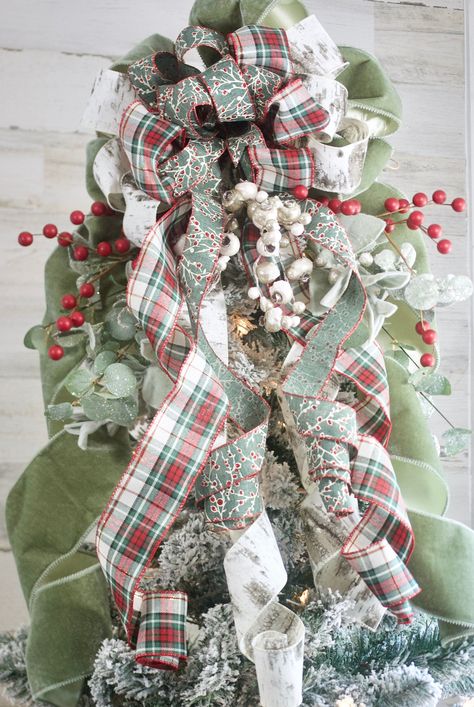 "PLEASE READ ENTIRE LISTING THERE ARE SOME CHANGES: Limited for 2023! Velvet Tree Topper. We are seeing a shift back to traditional Christmas. This Old World, Velvet Tree Topper is combined with a modern luxury unequalled on the market. A designer, high end, Christmas Tree topper, features a luxurious sage velvet ribbon, green red and white plaid ribbon, birch ribbon and a sage ribbon with white snowflakes. Also comes with a realistic eucalyptus and lambs ear greens and faux berries. Tree Topper Red And Sage Christmas Tree, Christmas Tree Lace Ribbon, Green And Ivory Christmas Tree, Tartan Christmas Tree Ideas, Red And Sage Green Christmas Tree, Christmas Tree Plaid Ribbon, Sage Green And Red Christmas Decor, Green Velvet Ribbon Christmas Tree, Boho Christmas Tree Topper