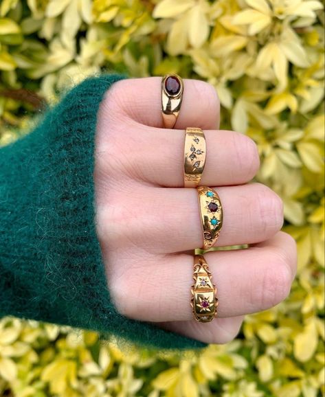 A fistful of gold English rings. Three are antique and two have starburst set stones. The other is a vintage garnet cabochon #celestial #antiquerings #antique #starburst #starburstrings #starsetring #victorianring #edwardianring #vintagering Jewellery Lookbook, Starburst Ring, Edwardian Ring, Victorian Rings, Jewelry Lookbook, Antique Rings, Cute Jewelry, Vintage Rings, Ring Sets