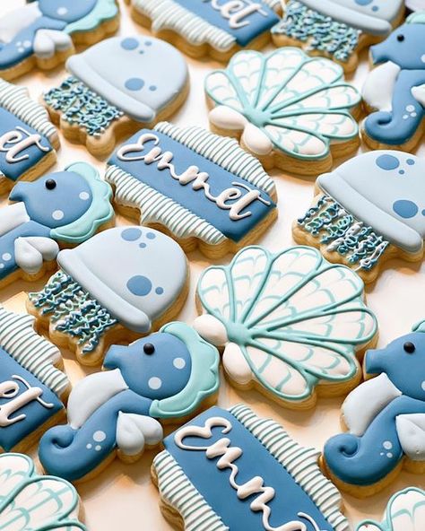 Jamie Garner | Cookie Artist on Instagram: "🐚🪸Under the Sea baby shower for Baby Emmet! So cute!!! 🪸🐚 . . . #festivelyfrostedcookieco #decoratedsugarcookies #decoratedcookies #cookies #cookiegram #instacookies #sugarcookies #sugarcookiesofinstagram #cookiesofinstagram #cookiersofinstagram #cookier #decoratedcookiesofinstagram #decoratedsugarcookiesofinstagram #babyshowertreats #babyshowercookies #undertheseacookies #jellyfishcookies #shellcookies #seahorsecookies #babyboycookies #flatlay #fl Sea Baby Shower Theme, Beach Theme Birthday Party, Ocean Baby Shower Theme, Beach Theme Birthday, Baby Boy Cookies, Ocean Baby Showers, Ocean Birthday Party, Royal Iced Cookies, Baby Christmas Photos