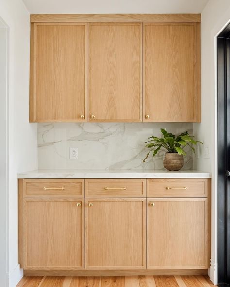 This small space between a back door and a guest bathroom might be seen as a deadzone, but these custom cabinets boost storage and counter space — perfect for placing a spread while entertaining, or brewing your morning coffee.   #custommade #customcabinetry #customcabinetslosangeles #customkitchen #whiteoakkitchen #localbusiness #ventura #805 #santabarbara #montecito #slimshakercabinets #shakercabinets #naturallight Slab Front Cabinets, Maple Shaker Kitchen Cabinets, Kitchen Wall Covering, Slim Shaker Cabinet, Adu Kitchen, Oak Kitchens, Slab Cabinets, Kitchen Slab, White Oak Kitchen