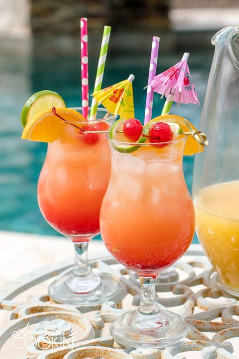 Pineapple juice and orange juice come together with dark rum and grenadine to make an irresistible summer rum punch cocktail! Perfect for pool parties and backyard barbecues! #rumpunch #rummixeddrinks #summerdrinks #rumcocktails #rumpunchrecipe #summercocktails #drinkswithrum #cocktails #amandascookin Moschino 2023, Summer Mixed Drinks, Rum Mixed Drinks, Rum Punch Cocktail, Rum Punch Recipe, Fruity Mixed Drinks, Poolside Cocktails, Rum Drinks Recipes, Rum Punch Recipes