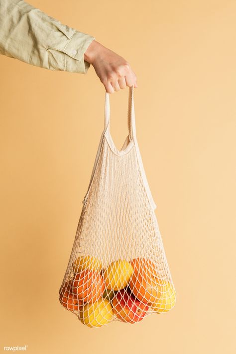 Hand holding a reusable net bag | premium image by rawpixel.com / Jira Plastic Bag Design, Blank Tote Bag, Fruit Bag, Fruit And Vegetable Storage, Hand Images, Bag Mockup, Net Bag, String Bag, Environmental Friendly