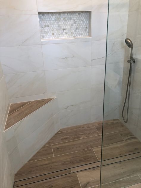 Walk In Shower Wood Floor, Gray Shower Tile With Wood Floor, Tiled Shower With Half Wall, Shower Tile Bench Ideas, Marble And Wood Look Tile Bathroom, Wood Tile Bathroom Shower Walk In, Showers With Niches And Bench, White Wood Tile Bathroom, Walk In Shower With Corner Bench