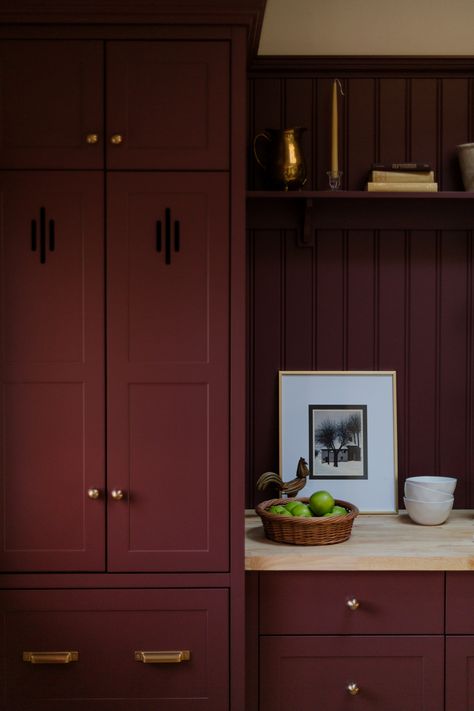 Traditional English inspired red kitchen renovation. Shaker doors with cut out detail, butcher block counter, brass cup pull, brass knobs, headboard backing Deep Red Cabinets, Burgundy Shaker Kitchen, Burnt Red Cabinets, Red Shaker Kitchen, Oxblood Kitchen Cabinets, Dark Burgundy Kitchen Cabinets, Wine Red Interior, Eggplant Kitchen Cabinets, Burgandy Kitchen Cabinet