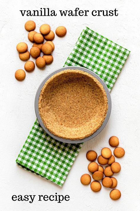 A vanilla wafer crust (AKA: Nilla wafer crust) in a metal pie pan. The pan is atop a green/white cloth gingham napkin. Also in the image is a double scattering of vanilla wafer cookies. This is an overhead image. The background is bright white. Vanilla Wafer Pie Crust Recipe, Nilla Wafer Crust, Banana Pudding Ingredients, Vanilla Wafer Crust, Food Processor Uses, Crumb Crust, Vanilla Wafer, Homemade Pie Crust Recipe, Homemade Pie Crusts