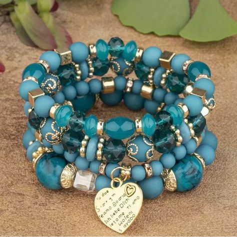 Beautiful Layered Bracelet Set In Turquoise And Gold Beads. The Gold Heart Charm Says “I Love You” In Multiple Languages. What A New Way To Show Your Love! You Can Wear All Four Bracelets Stacked Together Or Choose From Each Of Them Separately. So Versatile! I Have My Own, And The Beads Really Sparkle! I’ve Gotten Quite A Few Compliments! Boho Charm Bracelet, Bracelets Stacked, Layered Bracelet, Hari Valentine, Bohemian Accessories, Crystal Beads Bracelet, Valentines Jewelry, Layered Bracelets, Wire Bracelet