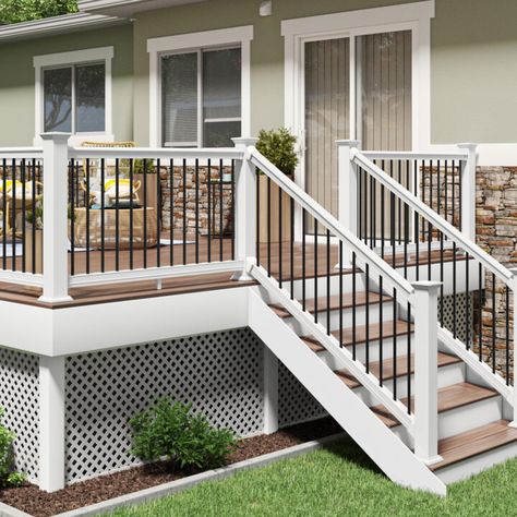 Cape Cod Porch Railing, Vinyl Deck Railing Ideas, High Porch Ideas, Backdoor Steps To Patio With Railing, White Deck Railing Ideas, Tan Deck With White Railing, Pvc Deck Railing Ideas, Wood Deck White Railing, Wood Deck With Vinyl Railing