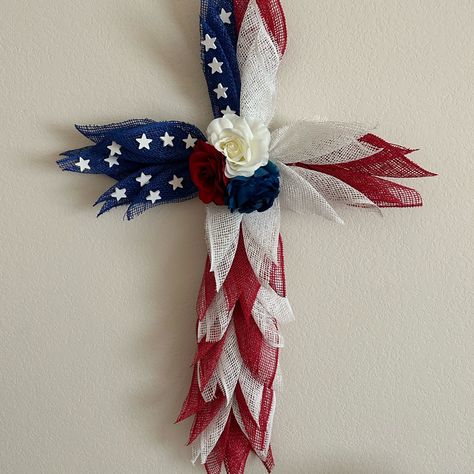 American Flag Deco Mesh Cross Wreath Made On A Wire Frame With Poly Deco Mesh, Roses And Wood Stars . This Wreath Is Made With Love And Is Great For Any Season . Mesh Cross Wreath, Deco Mesh Cross, Patriotic Wreath Diy, Cross Wreaths, Cross Wreath Diy, American Flag Cross, Ribbon Wreath Christmas, Mesh Cross, Christmas Advent Wreath