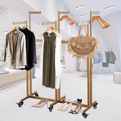 PRICES MAY VARY. STRONG AND DURABLE: Made of high quality metal, the adjustable clothing rack is known for its durability and strength to make any outfit stand out and look amazing. ADJUSTABLE: On this 6 way clothing rack, the straight arms are 14.96 inches. The height adjusts every 3in from 46.85 ins to 64 in. Also the arm height can be adjusted to different positions to accentuate garments on multiple levels. LARGE CAPACITY STORAGE: The adjustable setup means you can modify it as needed to ens Retail Clothing Racks, Clothing Rack Display, Clothing Store Displays, Clothing Store Interior, Clothing Store Design, Store Design Boutique, Clothing Displays, Clothes Stand, Boutique Decor