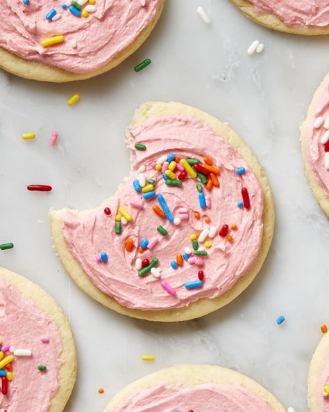 Close up shot of a lofthouse cookie with a bite taken out of it. Gluten Free Lofthouse Cookies, Loft House Cookies, Lofthouse Cookie Recipe, Old Fashioned Sugar Cookies, Store Cookies, Soft Frosted Sugar Cookies, Lofthouse Sugar Cookies, Lofthouse Cookies, Recipe Copycat