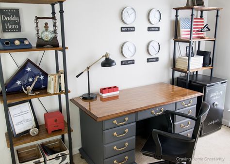 Masculine Office with Patriotic decor theme. World Wall clocks, Antique desk in Telegram gray, and Americana decorations on the shelves. Love this sophisticated office! Patriotic Office Decor, Americana Office Decor, Military Office Decor Ideas, Military Office Decor, Patriotic Office, Counselors Office, Masculine Office Decor, Patriotic Room, Military Home Decor