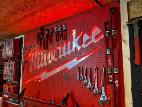 A milwaukee tools back lite pegboard garage center piece. Will update as tools are added Milwaukee Cordless Tools, Milwaukee Tool Box, Tool Pegboard, Pegboard Garage, Garden Tool Rack, Garage Organization Tips, New Milwaukee Tools, Workbench Plans Diy, Garage Tool Storage