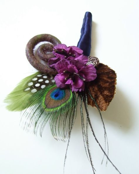 This boutonniere has been designed with small plum paper flowers, a peacock feather, a brown velvet millinery leaf, a green goose nagoire Unique Corsage, Hydrangea Boutonniere, Craft Bouquet, Corsage Ideas, Homecoming Flowers, 4h Projects, Feather Boutonniere, Prom Corsages, Wedding Boutonnieres