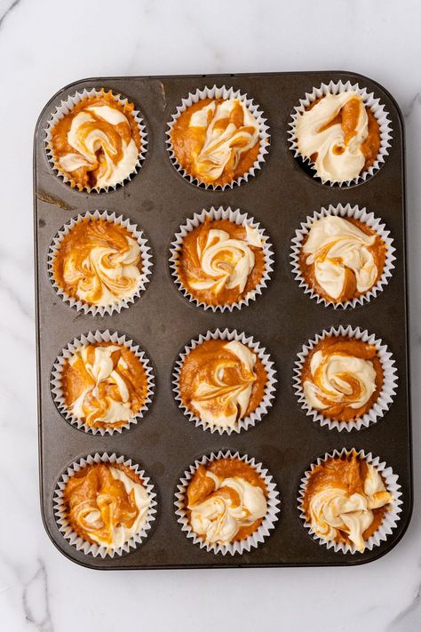 pumpkin cream cheese swirled muffin batter in white cupcake liners in a metal muffin pan Banana Nut Cream Cheese Muffins, Pumpkin Muffins With Cake Mix Cream Cheese, Thanksgiving Muffin Recipes, Mini Pumpkin Muffins With Cream Cheese, Pumpkin Cream Cheese Cupcakes, Thanksgiving Muffins, Pumpkin Cream Cheese Muffin, Cream Cheese Swirl Muffins, Starbucks Muffins