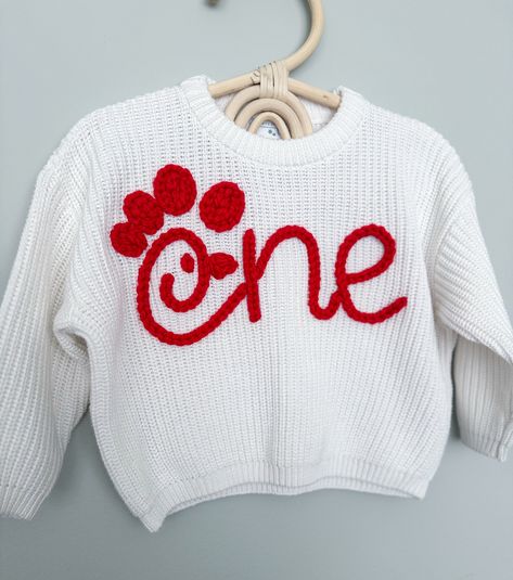 Custom Hand Embroidered Birthday Sweaters Are you looking for a sweater to fit the theme for your little one's birthday? Let's create a design that matches what you are looking for together!  MATERIALS/FIT: This set of hand embroidered sweaters are completely customizable and come in different colors. These sweaters have an oversized fit/feel, are 100% cotton, and a knit material, so they do have a stretch to them. See approximate measurements below:  Size/Length/Chest      * 0-3 M / 11 in / 12 Embroidered Knit Sweater, Embroidery Sweater Diy, Embroidered Sweaters, Name Sweater, Birthday Sweater, Sewing Machine Projects, Custom Sweaters, Kids Jumpers, Embroidery Sweater