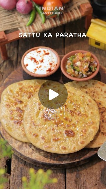 Swarna | Recipe video creator on Instagram: "Winter Comfort Ep 1 - Sattu ka paratha 😋 Ingredients: For sattu stuffing: Sattu - 2 cups Garlic - 2 tbsp Ginger -1 tbsp Green chilli - 1 tbsp Onion - 1/3 cup Kalonji - 1/2 tsp Ajwain - 1 tsp Salt to taste Achaar -1 tbsp Lemon juice - 1 tbsp Mustard oil - 2 tbsp Coriander leaves - 3 tbsp - Mix well and set aside. - Make semi soft roti dough using wheat flour water and salt. - Take a ball size portion of the dough. - Make space in the centre. Place the sattu filling. - Enfold the dough. Dip in some aata and roll out to make a thick paratha. - Place on a hot tawa and cook over medium heat on both sides. - Apply generous amount of ghee and cook until golden and crispy. - Serve hot with roasted tomato chutney and fresh curd. - Enjoy ☺️ ** Roaste Sattu Ka Paratha, Sattu Recipe, Sattu Paratha, Chilli Chutney Recipes, Soft Roti, Indian Cooking Videos, Tomato Chutney Recipe, Roti Recipe, Paratha Recipes