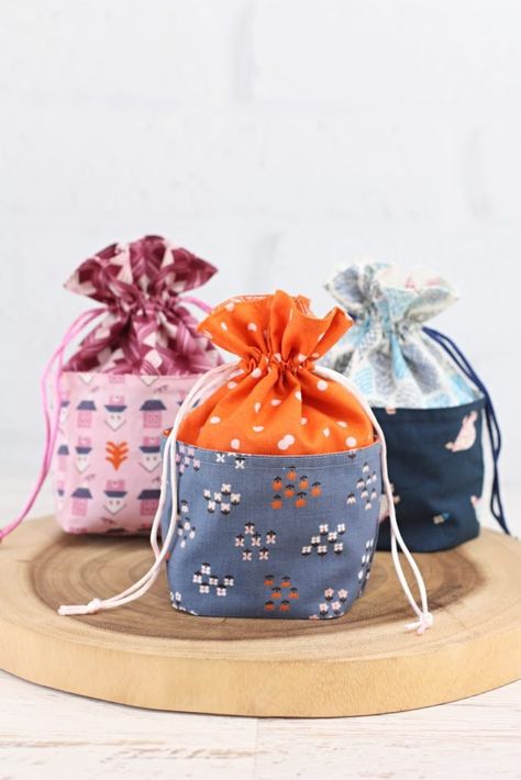 Mini Drawstring Gift Bag A Spoonful Of Sugar, Drawstring Gift Bag, Sweet Bags, Holiday Fabric, Pattern Store, Fabric Baskets, Bag Patterns To Sew, Gift Pouch, Fabric Gift Bags