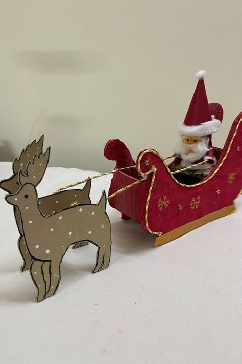 Use easily available materials at home to make your own Santa riding his reindeer sleigh. You can decorate your homes or use for school projects. Amaze your family and friends with this lovely piece of art!!! #christmas #christmasdecorationideas #santaclausmaking #diyhomedecor #santaclaus #craft #howto #projectideas #diycrafts #thanksgiving #holiday #artsandcrafts #cardboardcraft #papercraft #wastematerialcraft Diy Santa Sleigh, Christmas Craft Diy, Diy Christmas Door Decorations, Diy Christmas Door, Reindeer Sleigh, Craft From Waste Material, Sleigh Christmas, Diy Santa, Reindeer And Sleigh