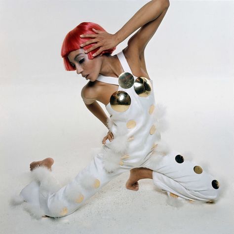 Model Kellie Wilson sophia upgrade wearing a Courreges bunny jumpsuit in white sateen, with white pompons, big brass polka dots and breast cups, and a red Dutch boy wig 1969. Photo by Bert Stern Andres Courreges, 60s Space Age Fashion, Courreges 1960s, Pier Cardin, Bonnaroo 2023, Futuristic Fashion Design, 60s Space Age, 1960s Space Age, Space Age Fashion