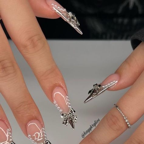 @kayykrylics on Instagram: "bday nails for my sissy🤍⛓️🖤   inspo @hui.nailedit with a twist  • • • • • • • • • • • • • #frenchtips #nailsdesign #nailsoftheday #nailsonfleek #nailinspo #explorepage #818nailtech #nailsofinstagram #nailart #kaybaesnails #nailartdesign #losangelesnailtech #818nails #nailinspiration #y2knails #y2k  #nailsnailsnails #beginnernailtech #viralnails #2024nails #newyearsnails #chromenails #valentinesnails" Long Chrome Heart Nails, Stilleto Nails Coquette, Chrome Nails Charms, Black Chrome Heart Nails Long, Chrome Y2k Nails + Charms, Chrome Nails Designs, School Nails, Cute Nail Art Designs, Colored Acrylic Nails