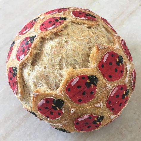 Painted Bread Loaf, Sourdough Painting, Ladybird Biscuits, Painted Sourdough Loaf, Scoring Bread, Bread Painting, Painted Bread, Ladybug On Mushroom, Ladybug Animal Aesthetic