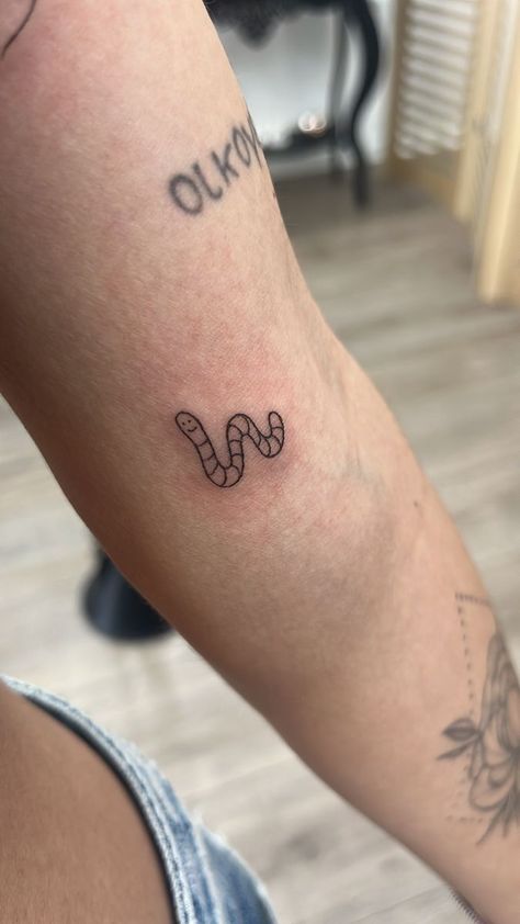 Tiny Worm Tattoo, Even A Worm Will Turn Tattoo, Small Worm Tattoo, Simple Bug Tattoo Ideas, Weirdo Tattoo Word, Worm Tattoo Ideas, Small Caterpillar Tattoo, Ink Box Tattoo Ideas, Cute Worm Tattoo